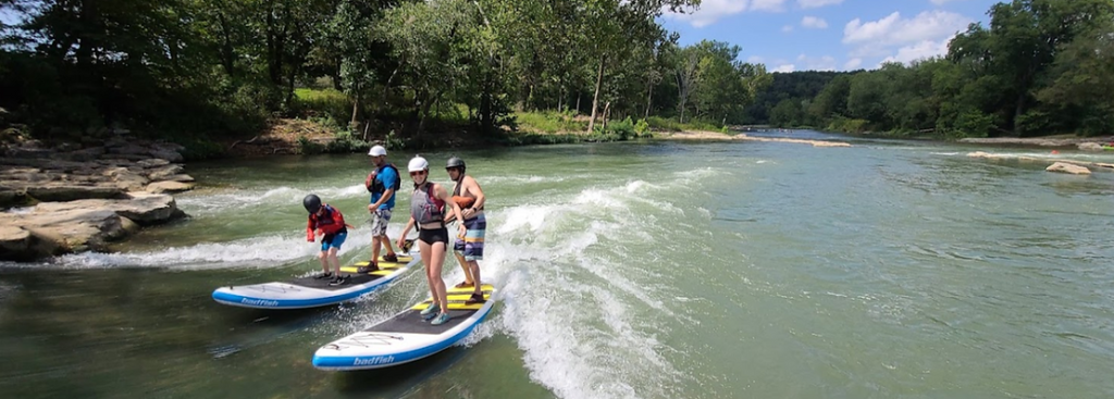 family paddleboarding at siloam springs kayak park