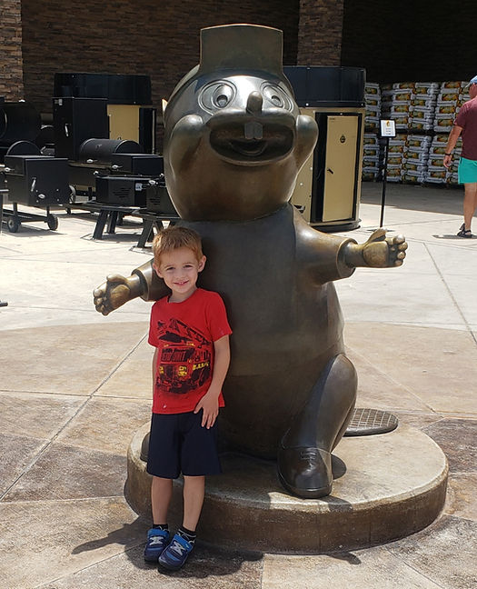 bucees metal statue and boy