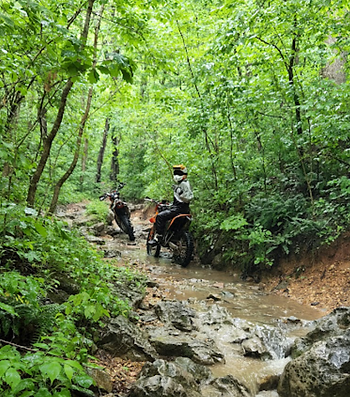 motorcycles riding creek on atv trail  mark twain forest