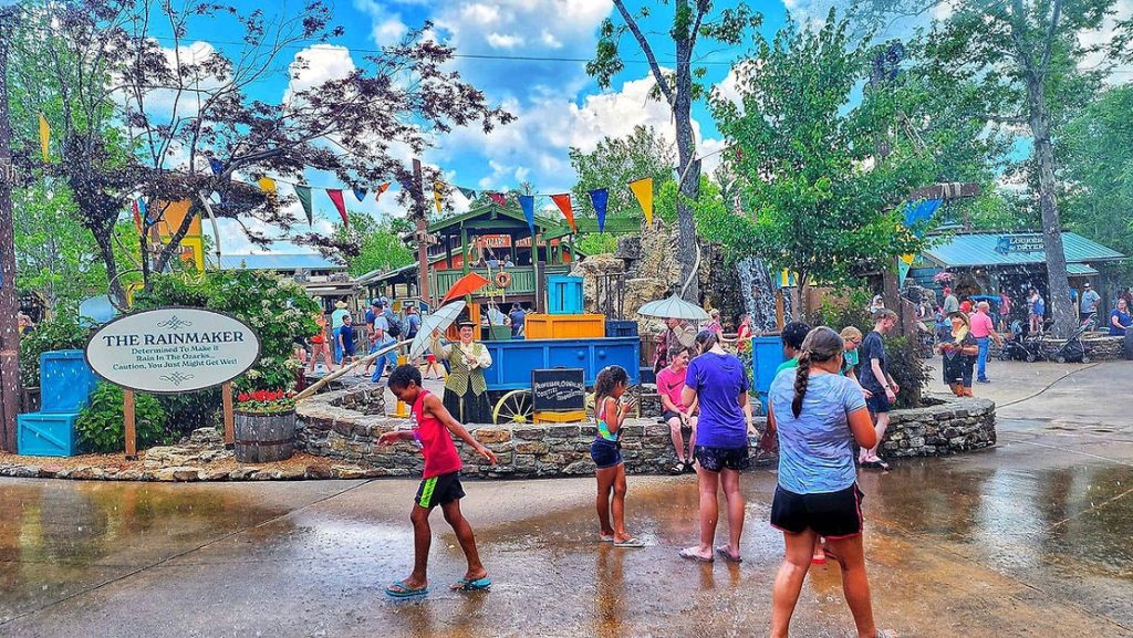 Children playing at the rainmaker