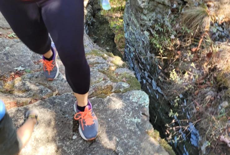 walking on trail at devils den state park 