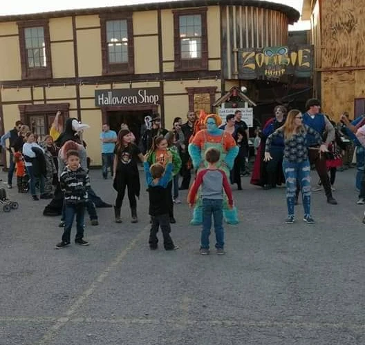 Children dancing at the Castle with performers