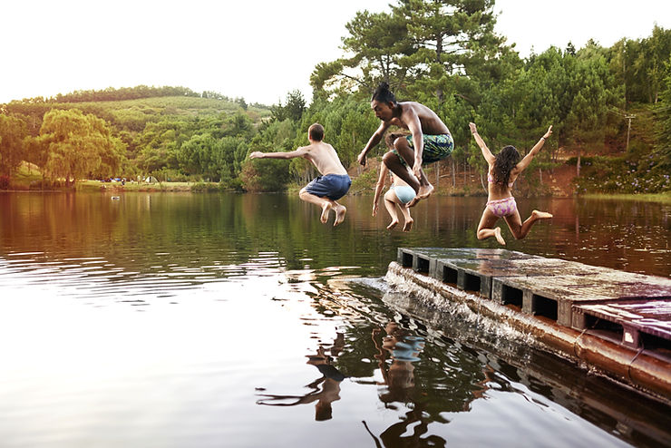 Kids jumping into lake 