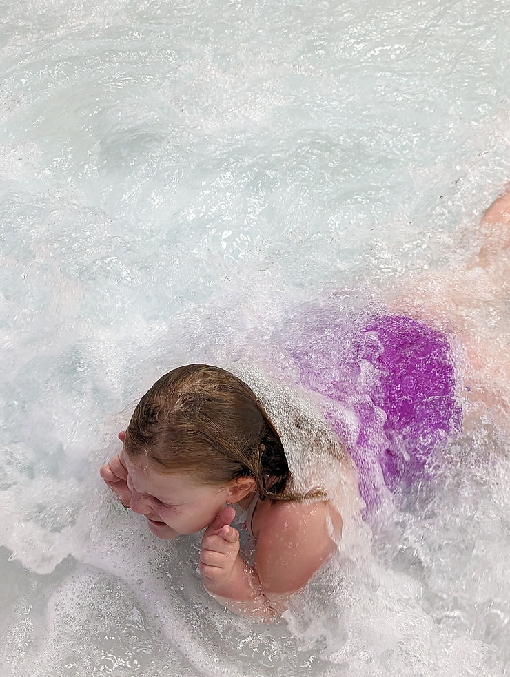 Child in wave pool