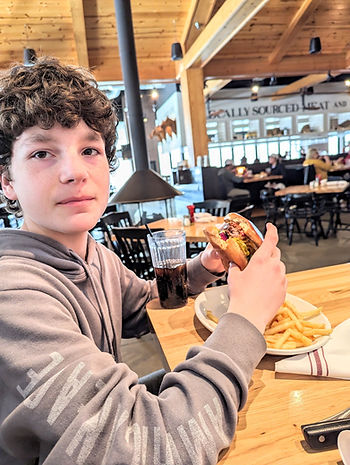 teen eating burger