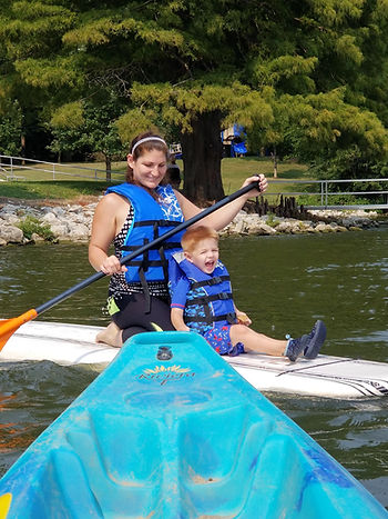 mom and son on paddleboard