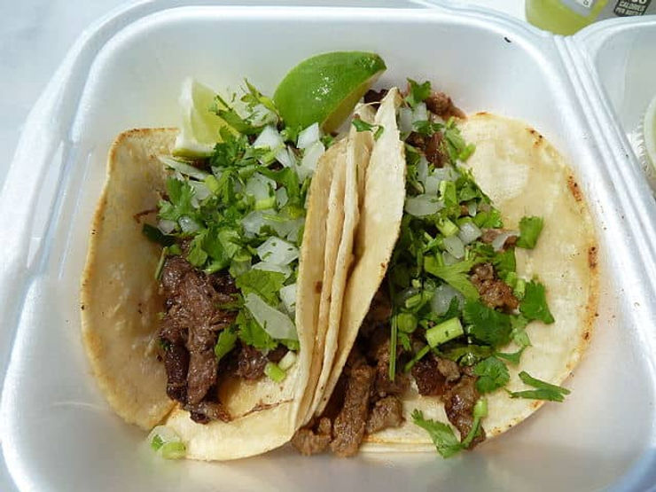 two street tacos with lime and cilantro